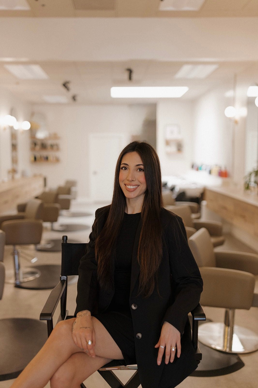 Alicia, stylist at Kinsley and Mane salon in director's chair