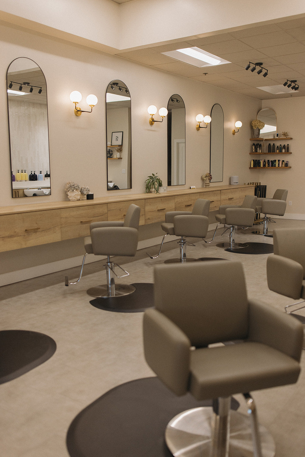 Kinsley and Mane Extension Lounge salon interior with styling chairs