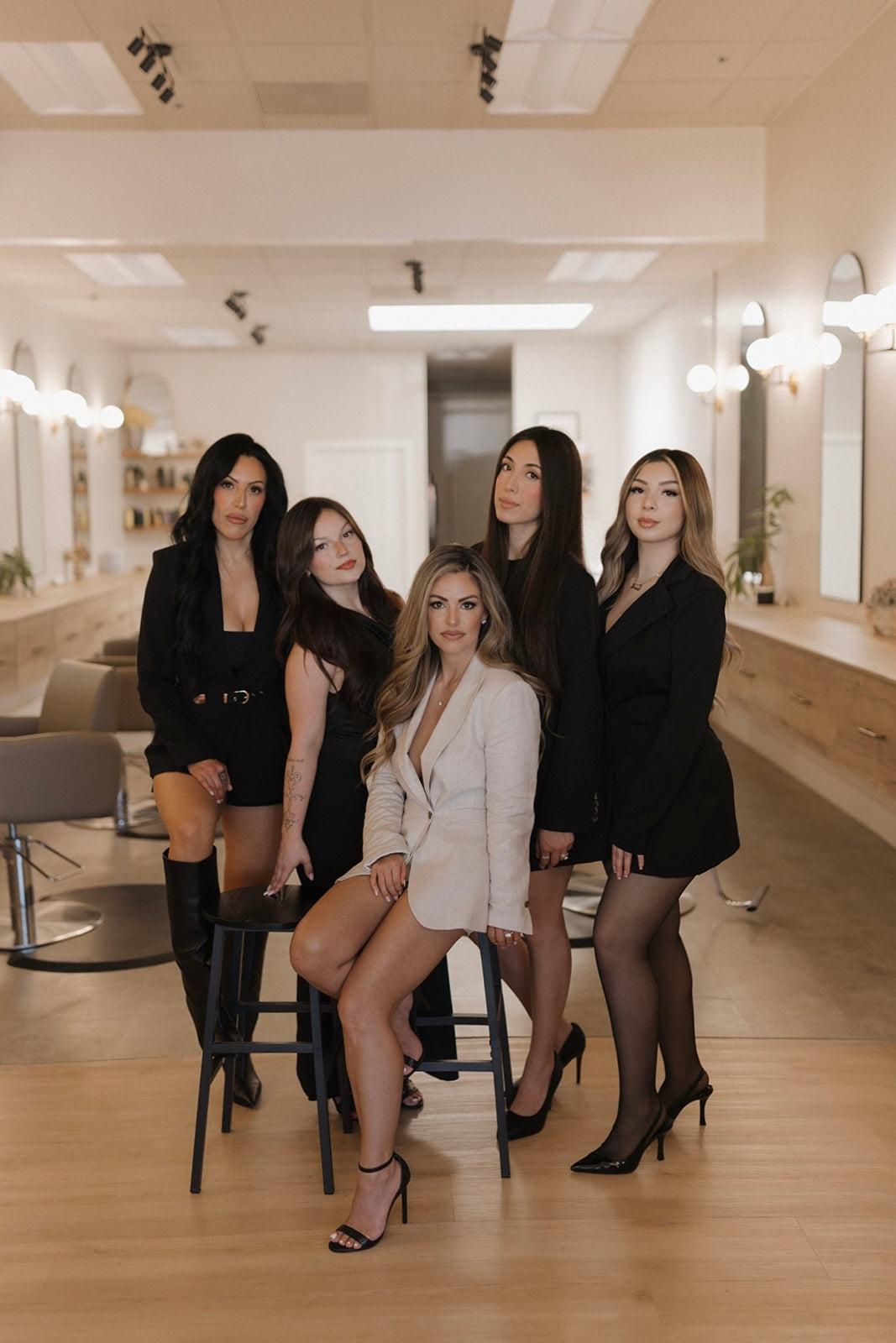 Kinsley and Mane team formal photo in black outfits